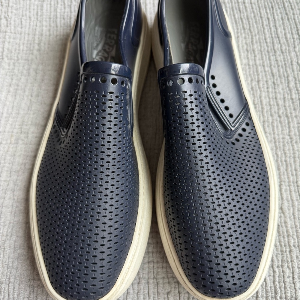 Men’s Salvatore Ferragamo Navy Perforated boat shoes.
